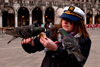 Young Girl Feeding Pigeons in Plaza San Marco