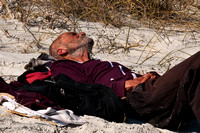 Homeless Man Sunning on Neptune Beach_CDS1949