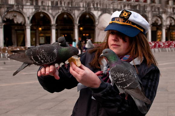 Young Girl Feeding Pigeons in Plaza San Marco